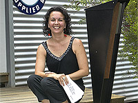 Kelly McDonald, of Queensland company Frontyard Art, with one of her companys ZINCALUME? steel letterboxes in the SPIKE range.